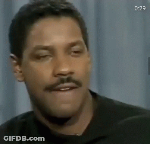A Close Up Of A Man With A Mustache Making A Funny Face GIF