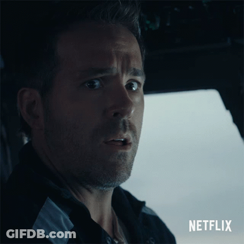 A Close Up Of A Man With A Netflix Logo Behind Him GIF