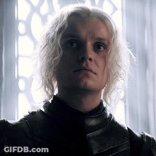 A Close Up Of A Man With Blonde Hair And A Black Jacket GIF
