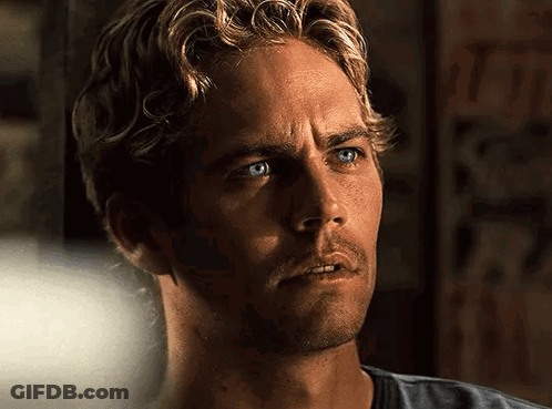 A Close Up Of A Man With Blue Eyes And Blonde Hair GIF