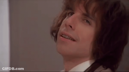 A Close Up Of A Man With Braces On His Teeth Looking Up . GIF