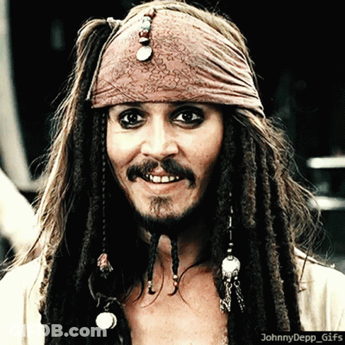 A Close Up Of A Man With Dreadlocks And A Bandana On His Head With The Caption Johnny Depp GIF
