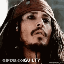 A Close Up Of A Man With Dreadlocks And A Beard . GIF