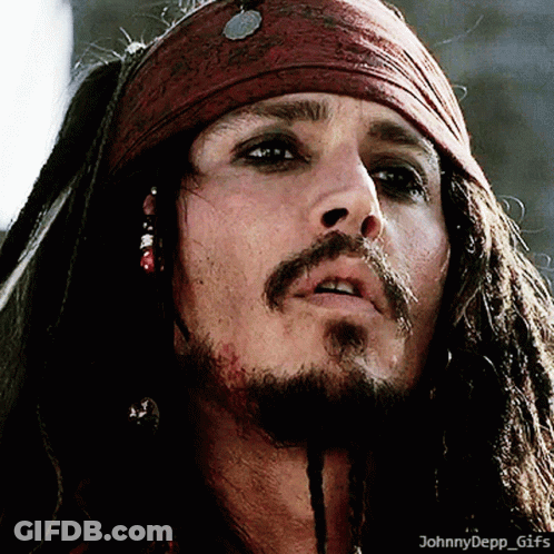 A Close Up Of A Man With Dreadlocks And A Scarf Around His Head GIF