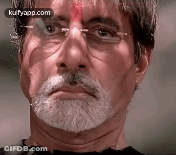 A Close Up Of A Man With Glasses And A Beard GIF
