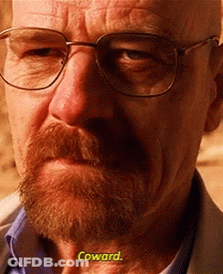 A Close Up Of A Man With Glasses And A Beard Says Coward GIF