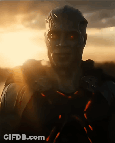 A Close Up Of A Man With Glowing Red Eyes GIF