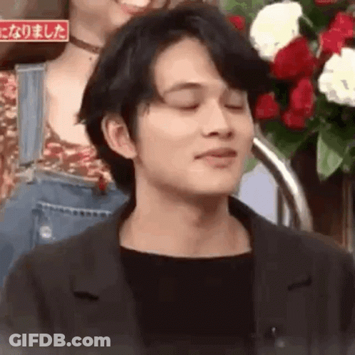 A Close Up Of A Man With His Eyes Closed . GIF