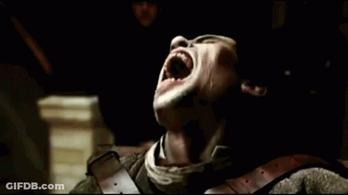A Close Up Of A Man With His Mouth Open Showing His Teeth GIF