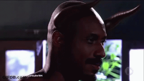 A Close Up Of A Man With Horns And The Hashtag Caminho De Coração194 On The Bottom GIF