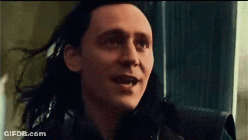 A Close Up Of A Man With Long Black Hair Making A Funny Face . GIF