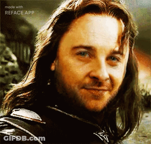 A Close Up Of A Man With Long Hair And A Beard . GIF