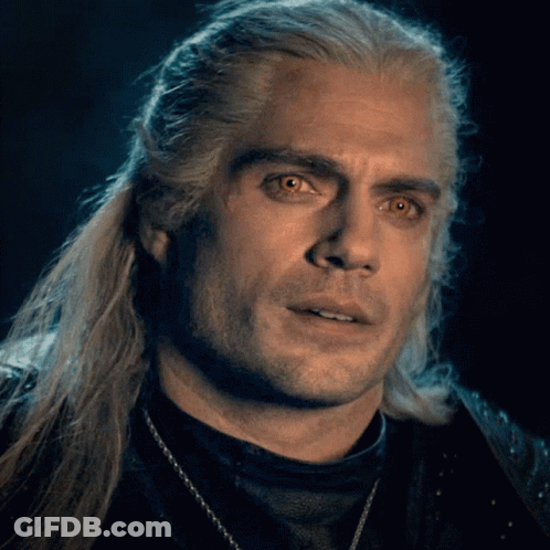 A Close Up Of A Man With Long White Hair GIF