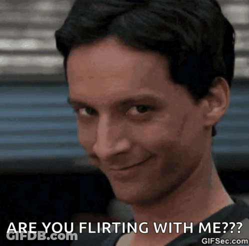 A Close Up Of A Man With The Words Are You Flirting With Me GIF