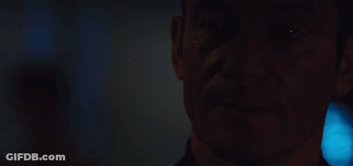 A Close Up Of A Man With The Words I Like To Think It Makes Me Mysterious GIF