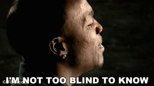 A Close Up Of A Man With The Words I 'M Not Too Blind To Know Below Him GIF