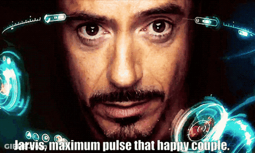 A Close Up Of A Man With The Words Jarvis Maximum Pulse That Happy Couple GIF