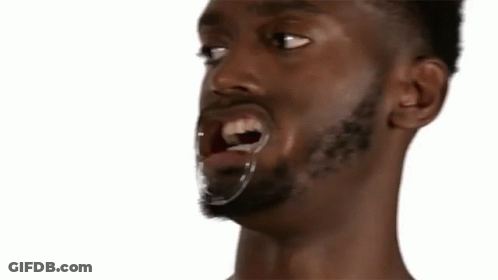 A Close Up Of A Man With The Words Warm Plum Pudding Behind Him GIF
