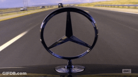 A Close Up Of A Mercedes Logo On A Car With A Blurred Background GIF