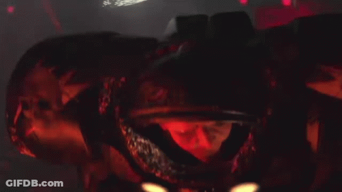 A Close Up Of A Metal Object With Flames Coming Out Of It 'S Mouth . GIF
