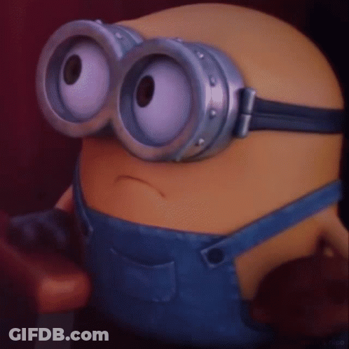 A Close Up Of A Minion Wearing A Pair Of Goggles GIF