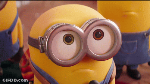 A Close Up Of A Minion Wearing Goggles And Making A Face GIF