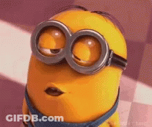 A Close Up Of A Minion Wearing Goggles And Making A Face . GIF