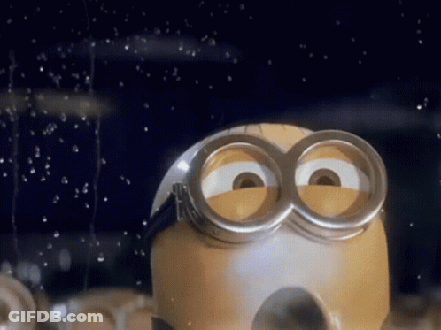A Close Up Of A Minion With A Pair Of Goggles GIF