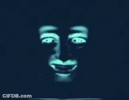 A Close Up Of A Monkey 'S Face With Glowing Eyes And A Smile . GIF