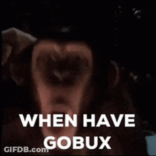 A Close Up Of A Monkey 'S Face With The Words When Have Gobux Written Above It . GIF