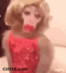 A Close Up Of A Monkey Wearing A Wig And A Pink Dress . GIF