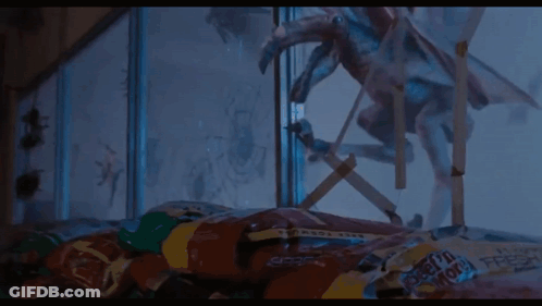 A Close Up Of A Monster Flying Through The Air . GIF
