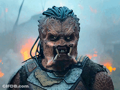 A Close Up Of A Monster 'S Face With A Fire Background GIF