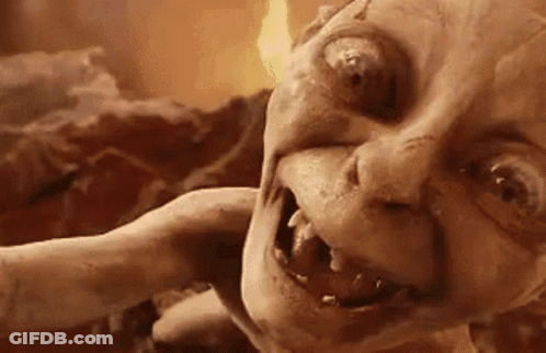 A Close Up Of A Monster 'S Face With A Flame Coming Out Of Its Mouth . GIF