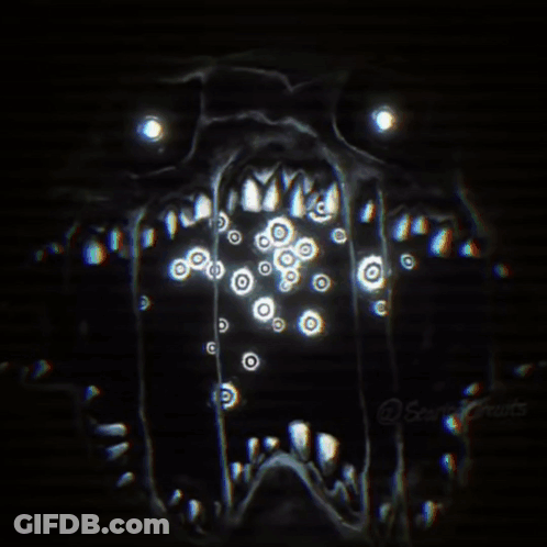 A Close Up Of A Monster 'S Face With A Lot Of Eyes Coming Out Of It 'S Mouth . GIF