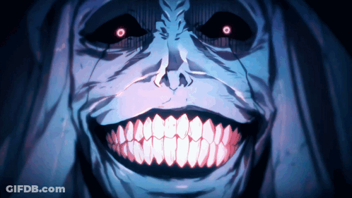 A Close Up Of A Monster 'S Face With Large Teeth And Red Eyes GIF