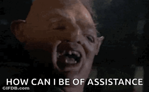 A Close Up Of A Monster 'S Face With The Words How Can I Be Of Assistance GIF
