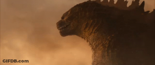 A Close Up Of A Monster 'S Head With Its Mouth Open GIF