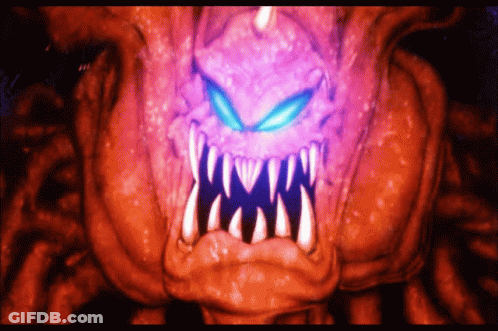 A Close Up Of A Monster 'S Mouth With Purple Eyes And Teeth GIF