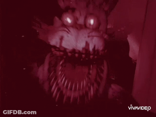 A Close Up Of A Monster 'S Mouth With Sharp Teeth And Eyes . GIF