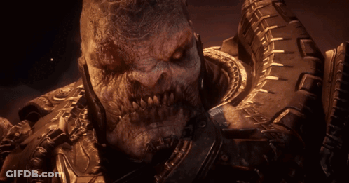 A Close Up Of A Monster With A Tire On His Back GIF