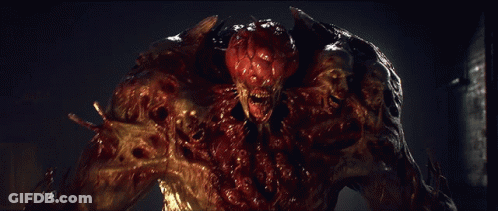 A Close Up Of A Monster With Blood Coming Out Of It GIF