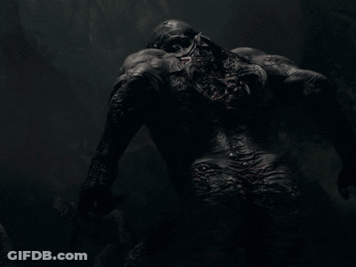 A Close Up Of A Monster With Blood Coming Out Of Its Mouth GIF