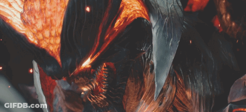 A Close Up Of A Monster With Flames Coming Out Of It 'S Mouth GIF