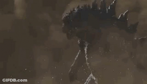 A Close Up Of A Monster With Its Mouth Open In The Sand . GIF