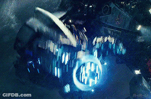 A Close Up Of A Motorcycle With A Blue Light Coming Out Of The Headlight GIF