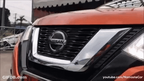 A Close Up Of A Nissan Car 'S Grille GIF