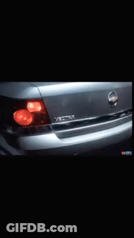 A Close Up Of A Nissan Car With A Black Background GIF