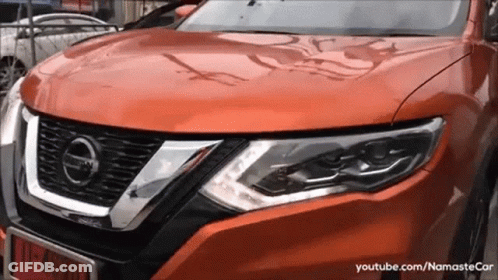 A Close Up Of A Nissan Car With A License Plate That Says 11-49301 GIF