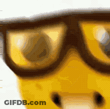 A Close Up Of A Pair Of Glasses With A Yellow Face In The Background GIF
